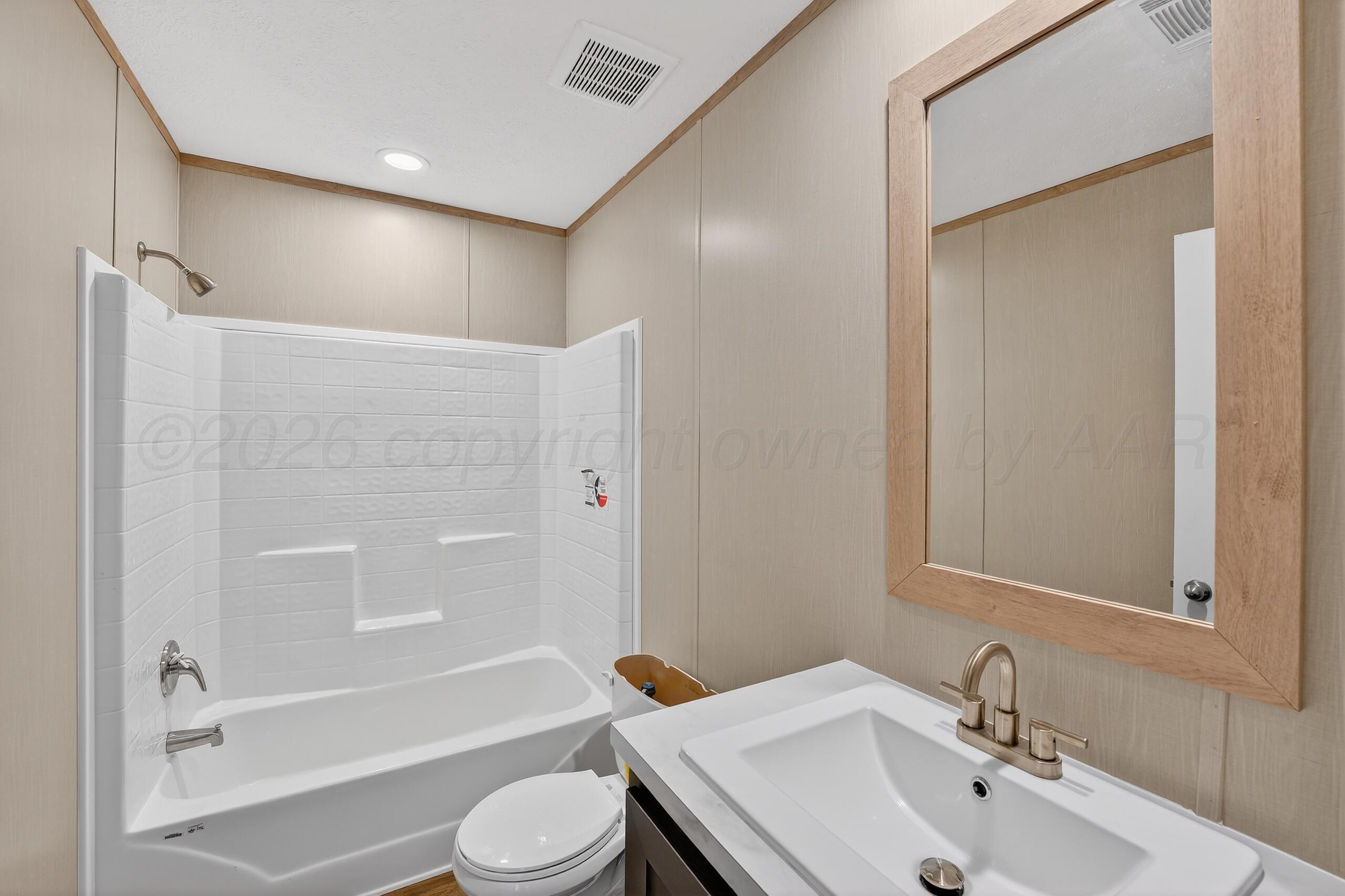 2680 Avery Rd Canyon Canyon, TX 79015 - Photo 27 of 37 a bathroom with a sink toilet and a bathtub