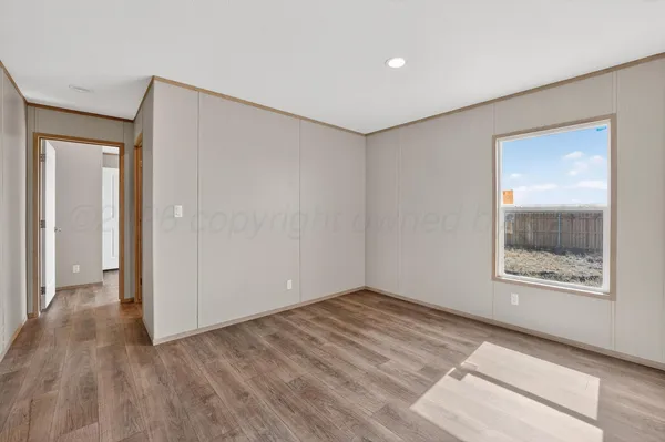 a view of an empty room and window