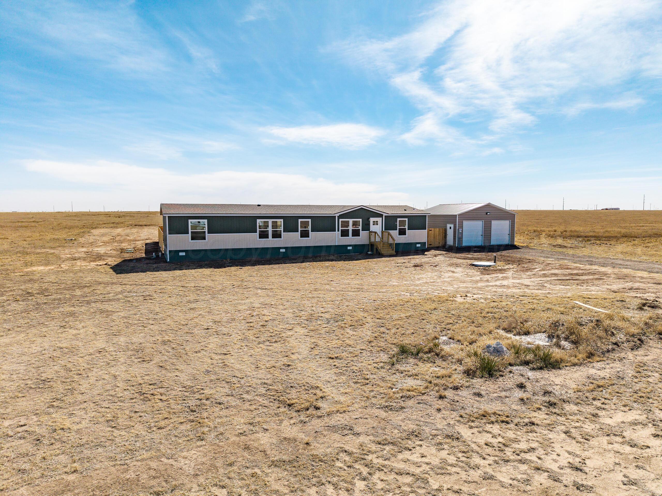 2680 Avery Rd Canyon Canyon, TX 79015 - Photo 3 of 35 a view of a building with floor to ceiling windows