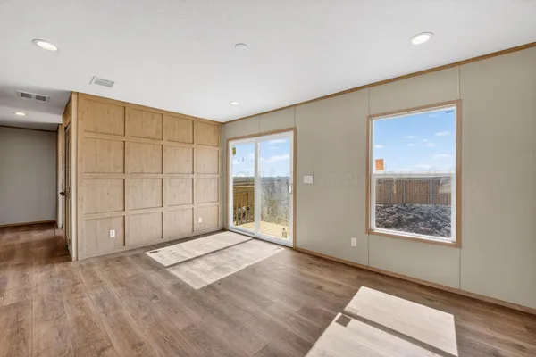 a view of an empty room with a window