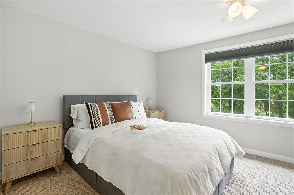 2 Sandpiper Way, Unit A Salisbury, MA 01952 - Photo 14 of 30 a large bed sitting in a bedroom next to a window