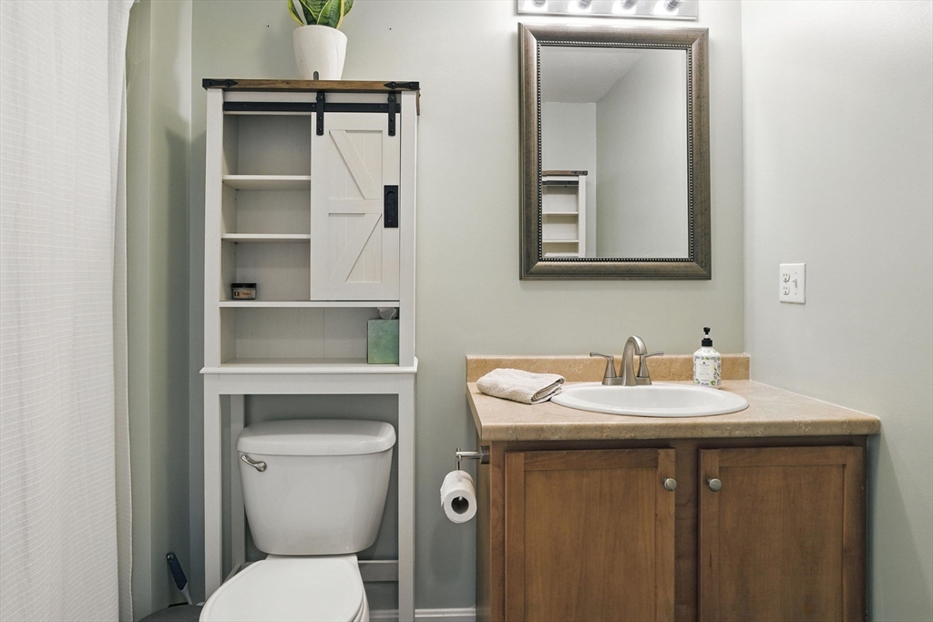 2 Sandpiper Way, Unit A Salisbury, MA 01952 - Photo 16 of 30 a bathroom with a toilet sink and mirror