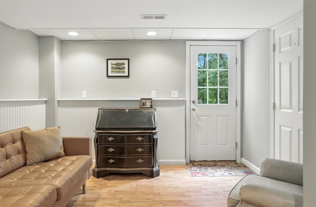 2 Sandpiper Way, Unit A Salisbury, MA 01952 - Photo 20 of 30 a living room with a couch and a stove