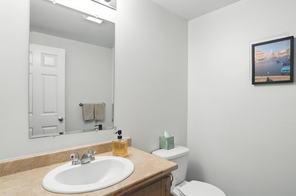 2 Sandpiper Way, Unit A Salisbury, MA 01952 - Photo 9 of 30 a bathroom with a toilet a sink and mirror
