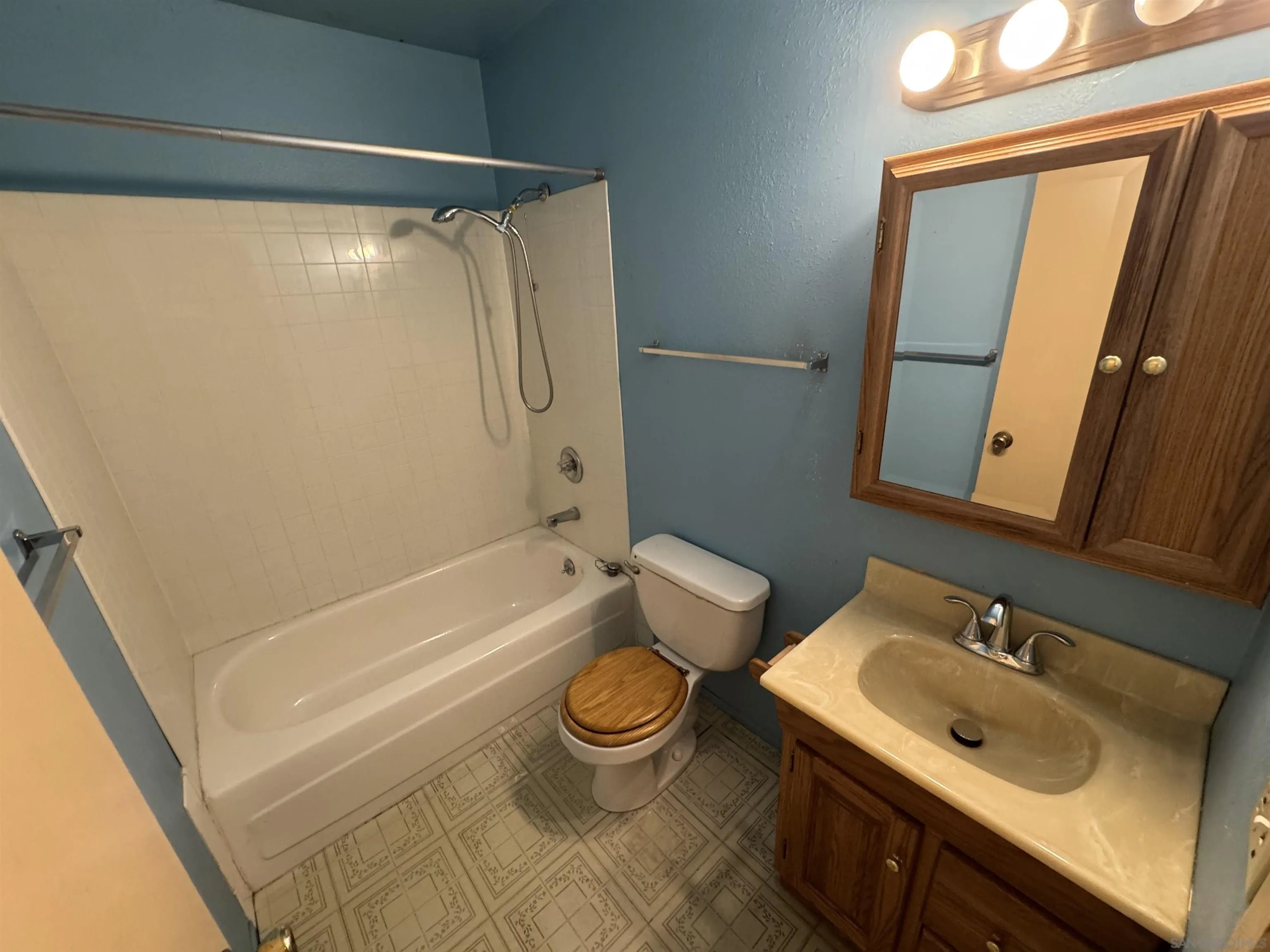 10490 Stanfield Circle San Diego, CA 92126 - Photo 13 of 21 a bathroom with a sink toilet and shower
