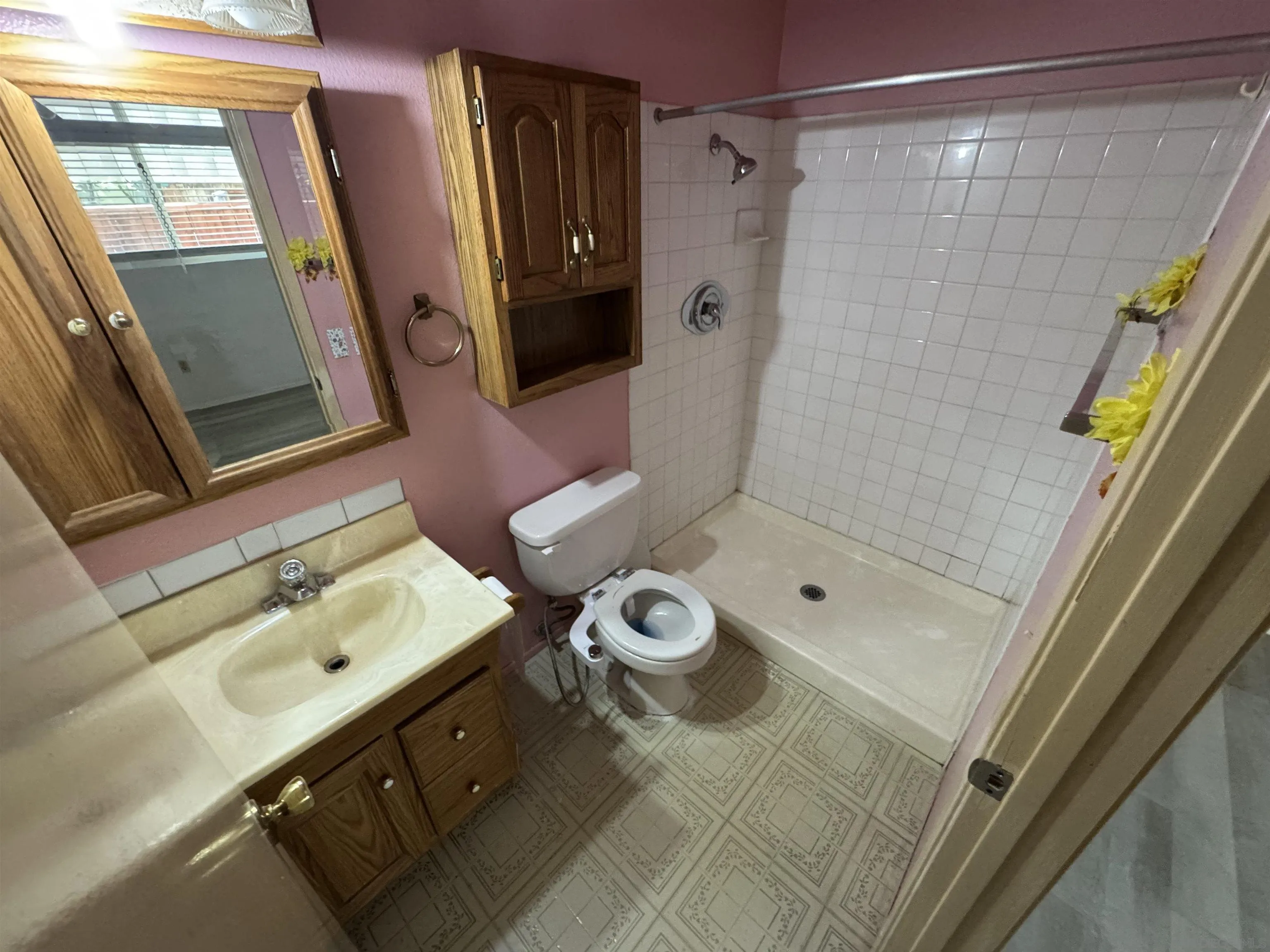 10490 Stanfield Circle San Diego, CA 92126 - Photo 16 of 21 a bathroom with a sink mirror and shower