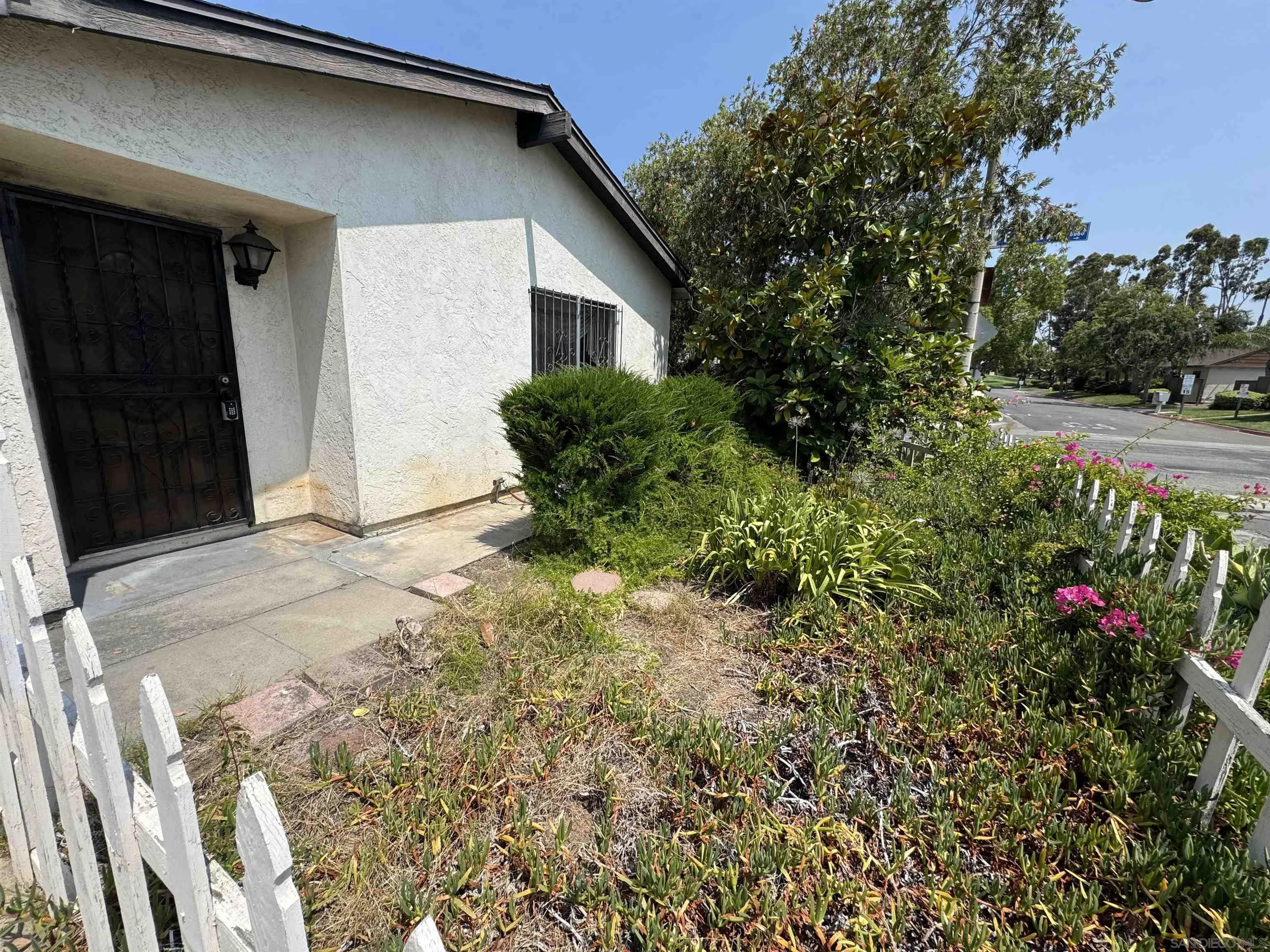 10490 Stanfield Circle San Diego, CA 92126 - Photo 21 of 21 a view of backyard with large trees and flower plants