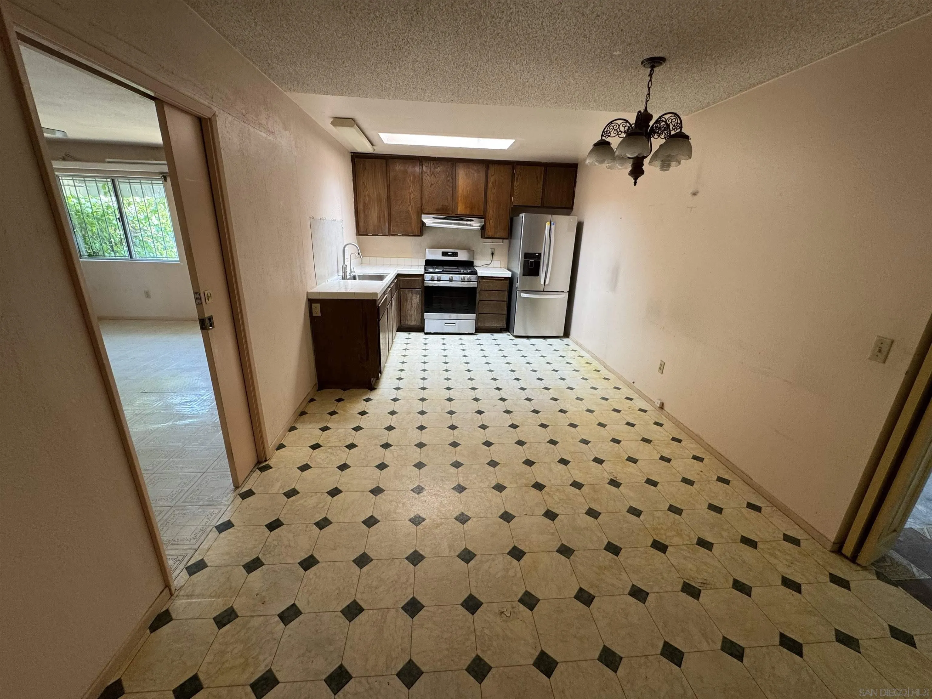 10490 Stanfield Circle San Diego, CA 92126 - Photo 6 of 21 a large bathroom with a sink a toilet a mirror and shower