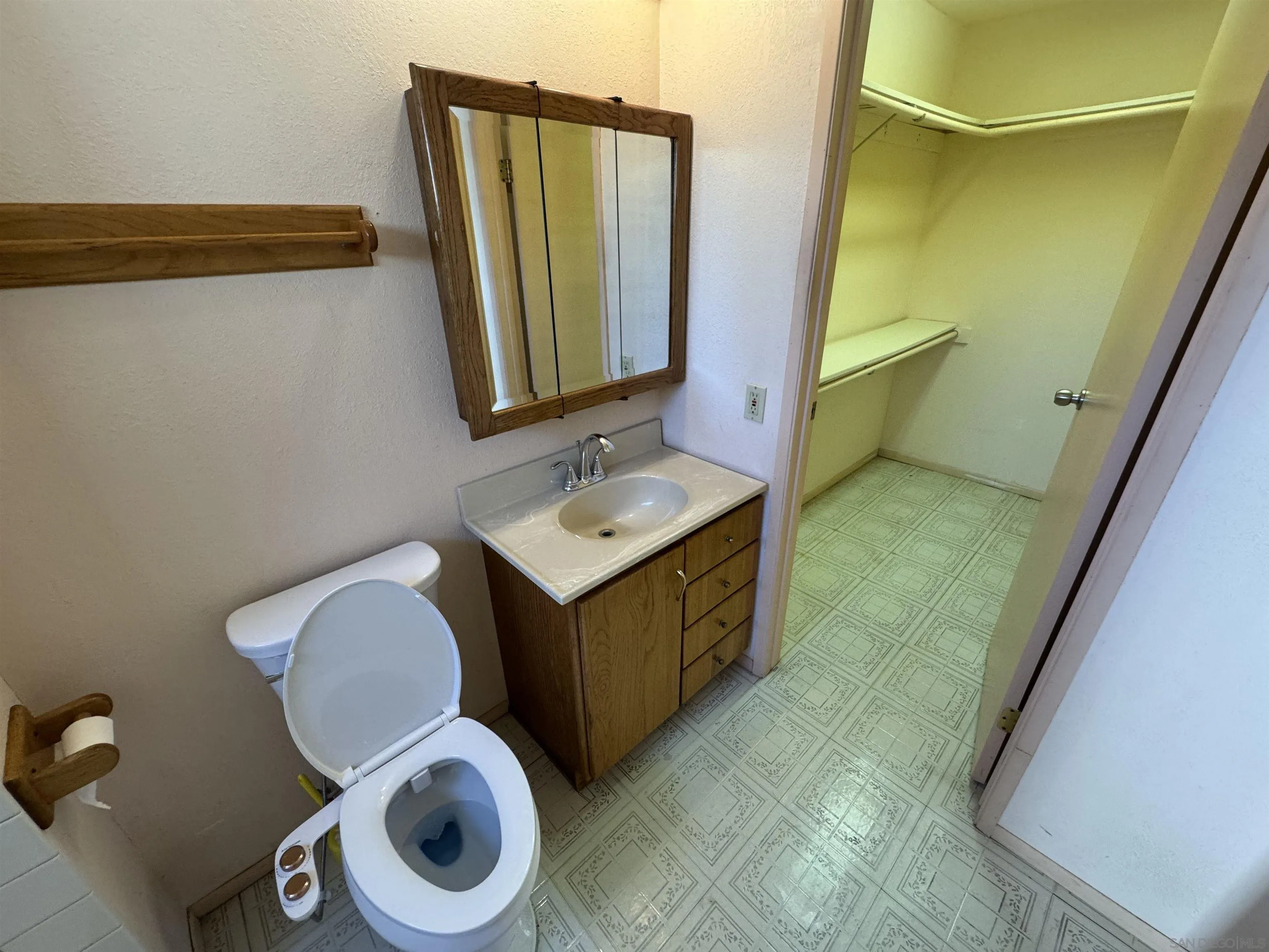 10490 Stanfield Circle San Diego, CA 92126 - Photo 10 of 21 a bathroom with a granite countertop sink and a mirror
