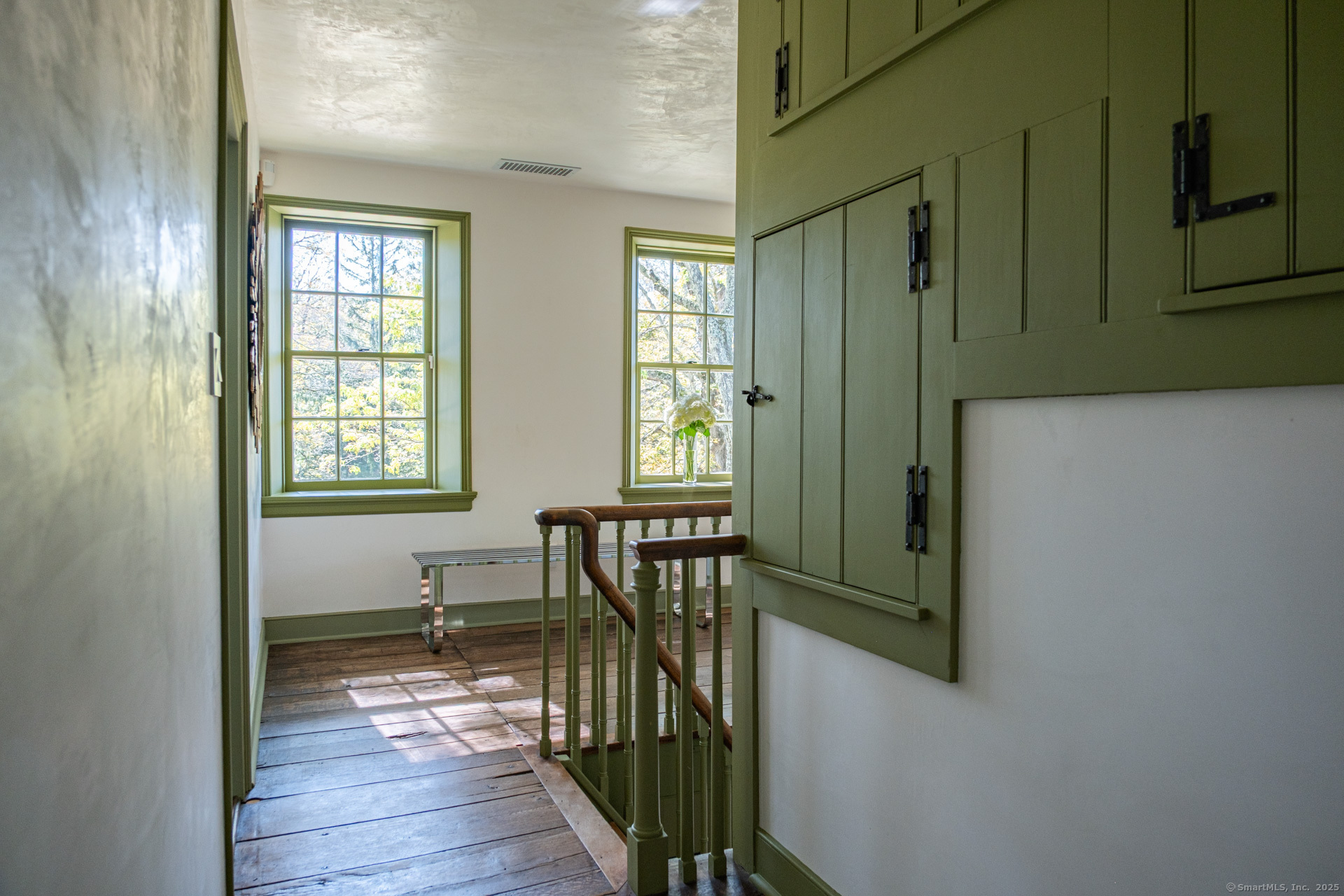 102 Melius Road Warren, CT 06754 - Photo 15 of 39 a view of a room with wooden floor windows and entryway