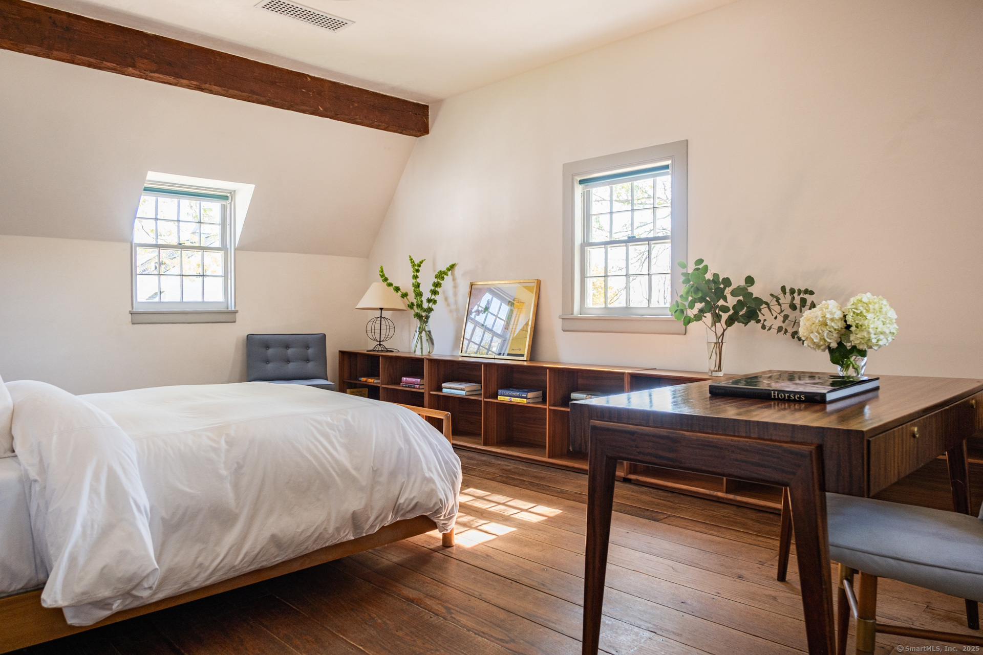 102 Melius Road Warren, CT 06754 - Photo 18 of 39 a bedroom with a bed table chair and a window