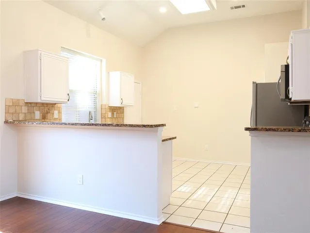 a view of a living room with a window