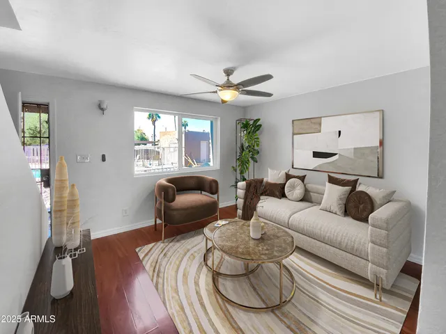 a living room with furniture rug and window
