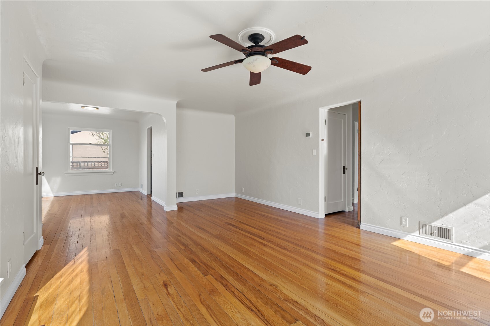 222 D Street Southwest Ephrata, WA 98823 - Photo 12 of 40 a view of empty room with wooden floor and ceiling fan