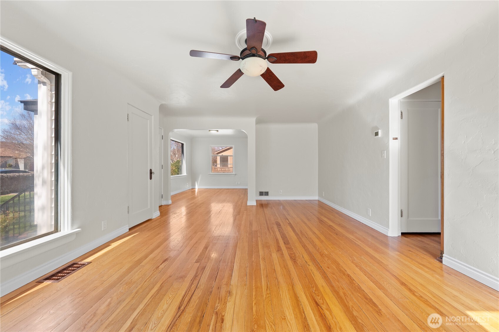 222 D Street Southwest Ephrata, WA 98823 - Photo 13 of 40 a view of empty room with wooden floor and fan