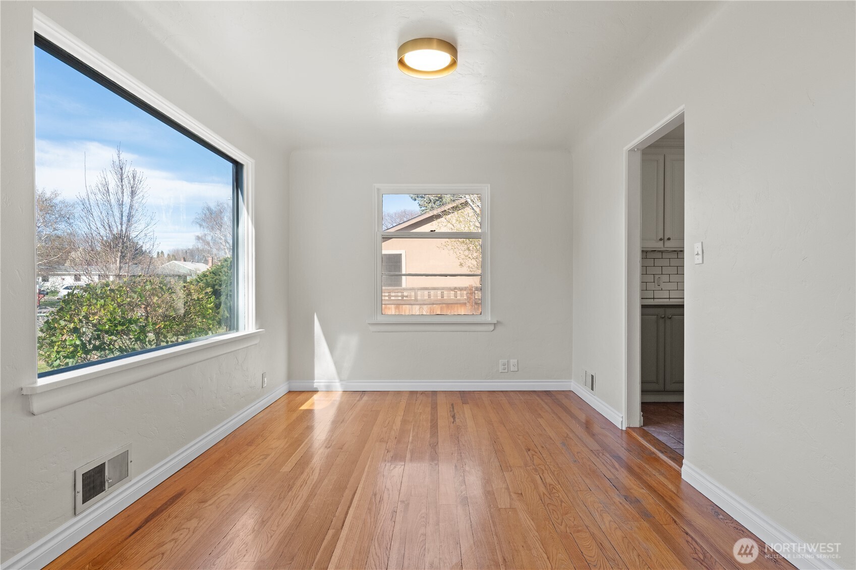 222 D Street Southwest Ephrata, WA 98823 - Photo 14 of 40 a view of empty room with wooden floor and fan