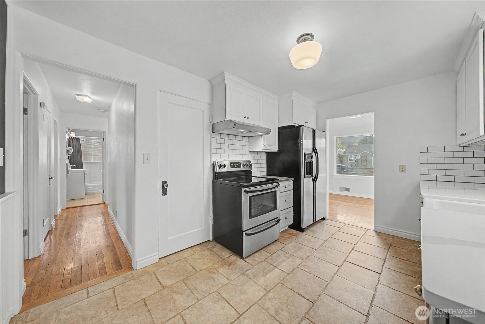 222 D Street Southwest Ephrata, WA 98823 - Photo 15 of 40 a kitchen with granite countertop a refrigerator and a stove top oven