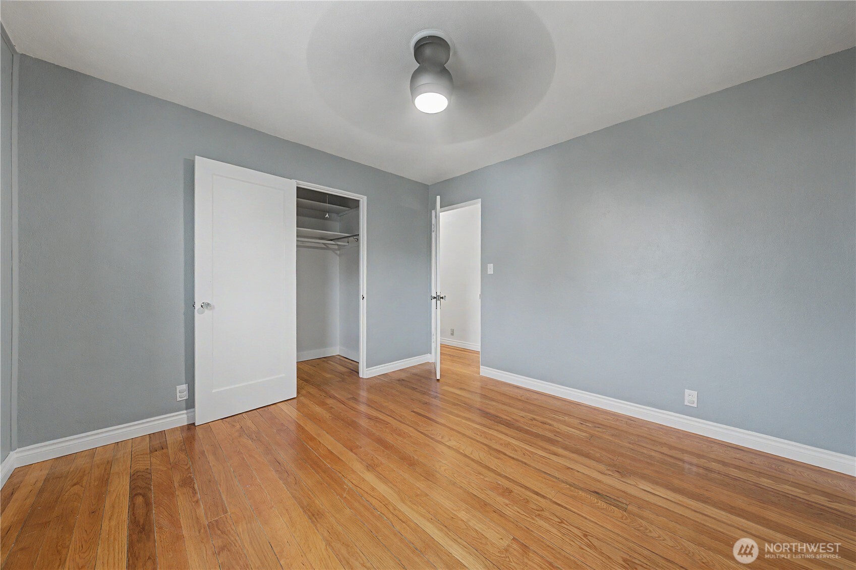 222 D Street Southwest Ephrata, WA 98823 - Photo 6 of 40 a view of an empty room with wooden floor and a window