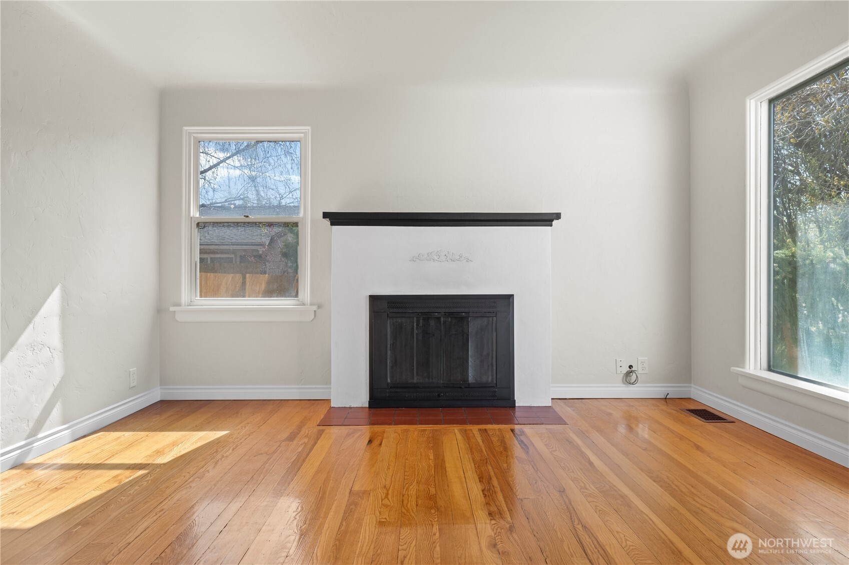 222 D Street Southwest Ephrata, WA 98823 - Photo 8 of 40 a view of an empty room with wooden floor and a window