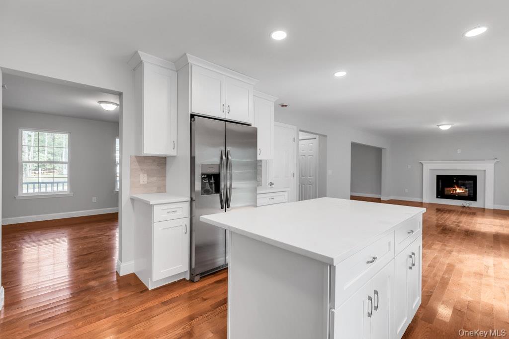 113 Currans Road Middle Island, NY 11953 - Photo 31 of 32 a large kitchen with a refrigerator a sink and a stove