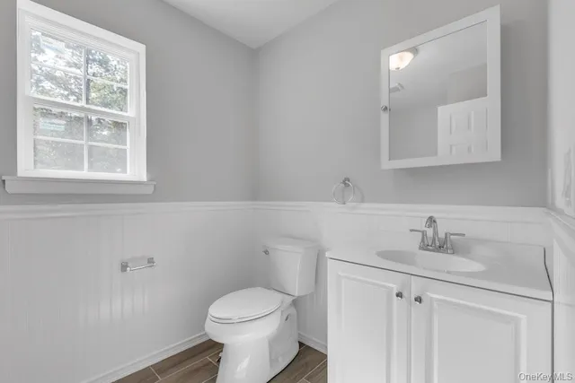 a large kitchen with a refrigerator a sink and a stove