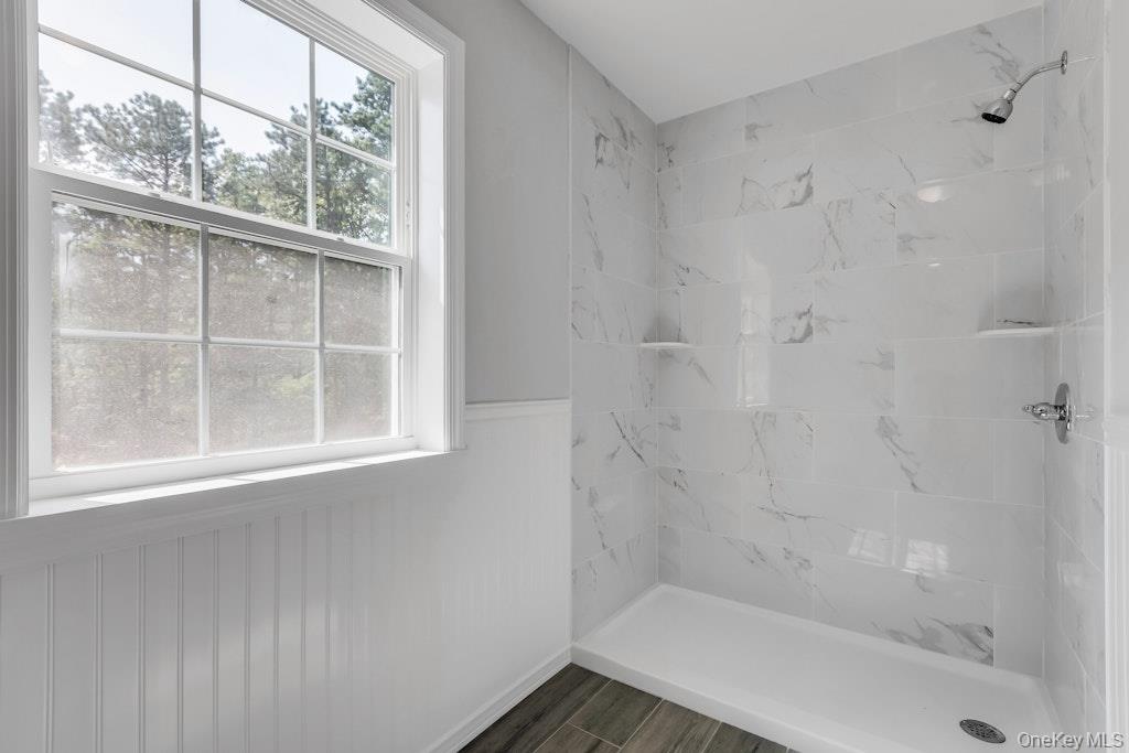113 Currans Road Middle Island, NY 11953 - Photo 23 of 32 a bathroom with a bathtub