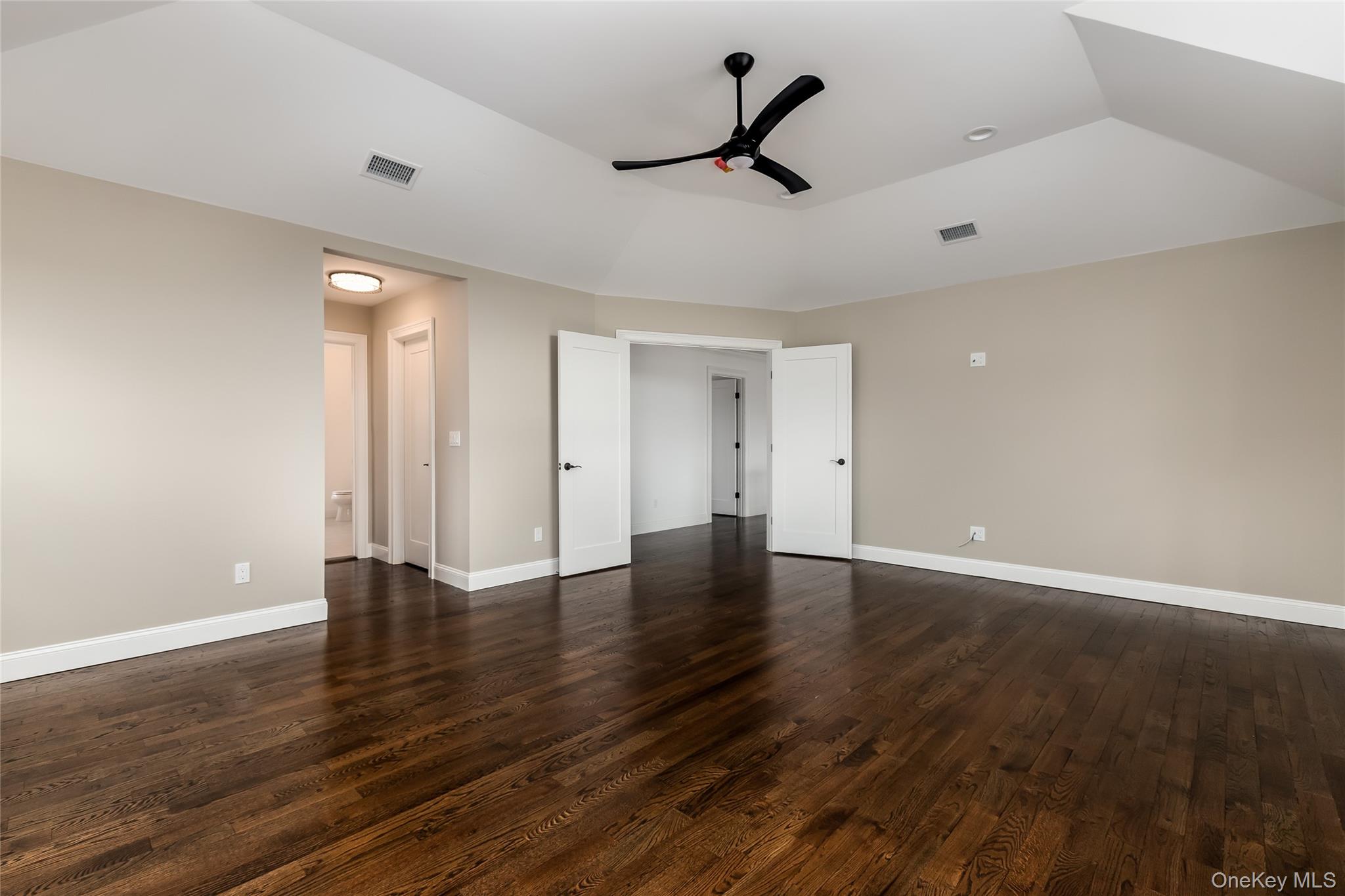113 Currans Road Middle Island, NY 11953 - Photo 10 of 32 a view of an empty room with wooden floor and a window