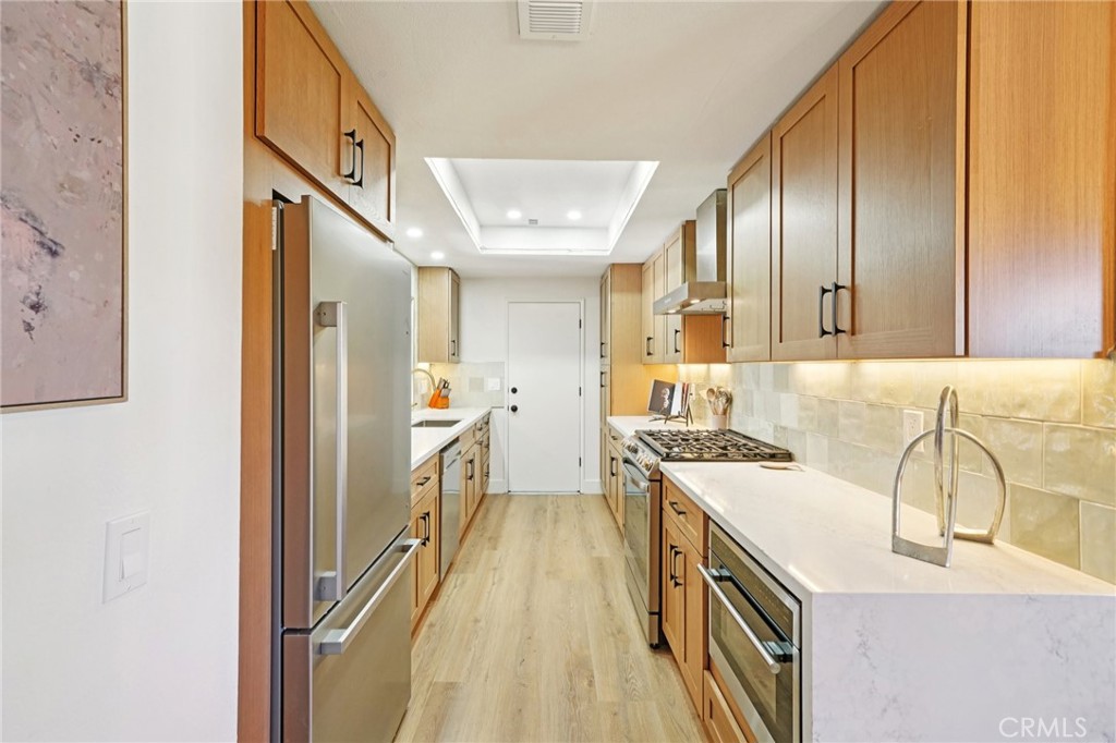 1500 Country Club Drive Riverside, CA 92506 - Photo 15 of 39 a kitchen with a sink stove and refrigerator