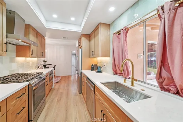 a view of hallway with wooden floor