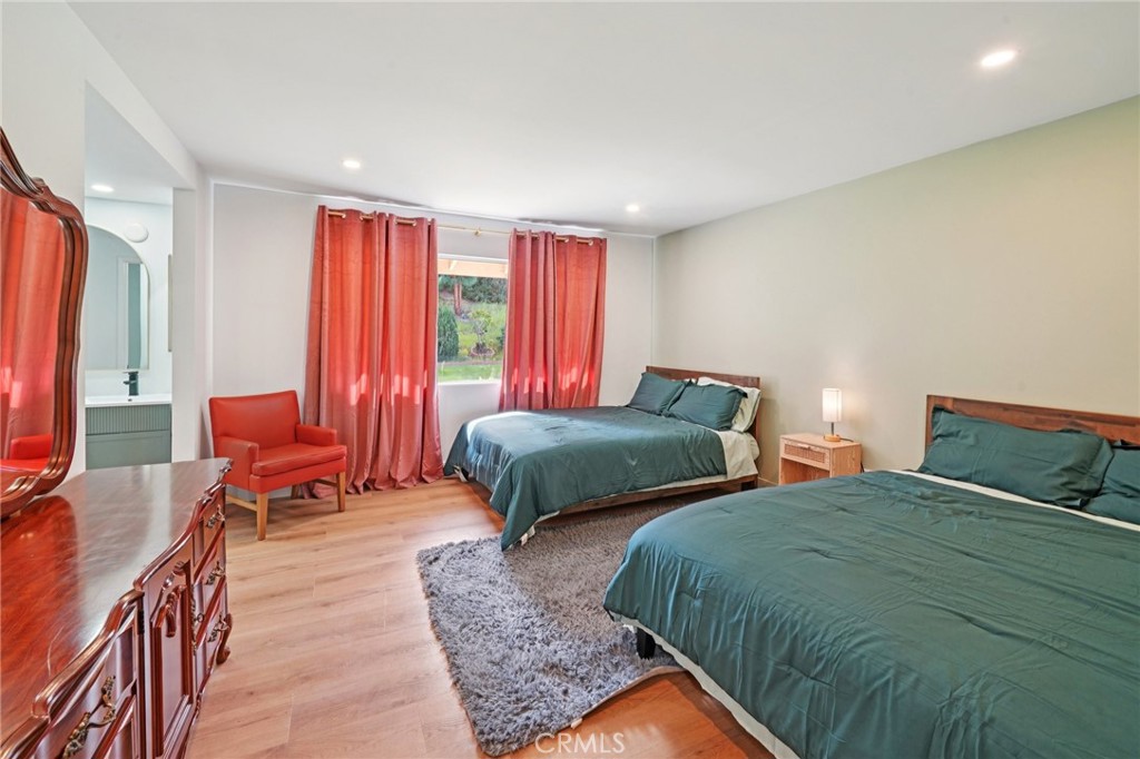 1500 Country Club Drive Riverside, CA 92506 - Photo 19 of 39 a bedroom with two beds and chair