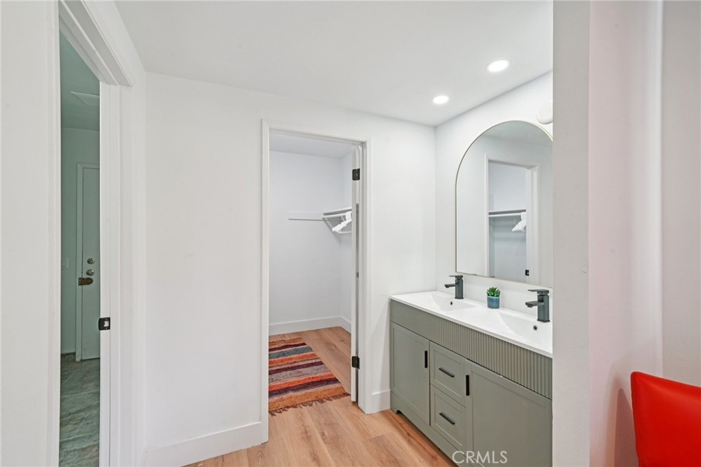 1500 Country Club Drive Riverside, CA 92506 - Photo 21 of 39 a bathroom with a double vanity sink and mirror