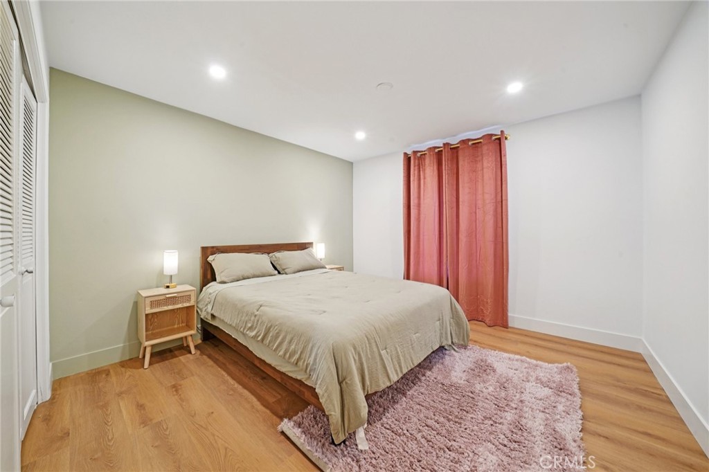 1500 Country Club Drive Riverside, CA 92506 - Photo 28 of 39 a bed room with a bed and a night stand