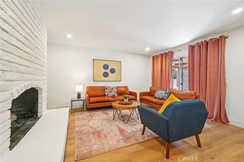 1500 Country Club Drive Riverside, CA 92506 - Photo 8 of 39 a living room with furniture and a fireplace