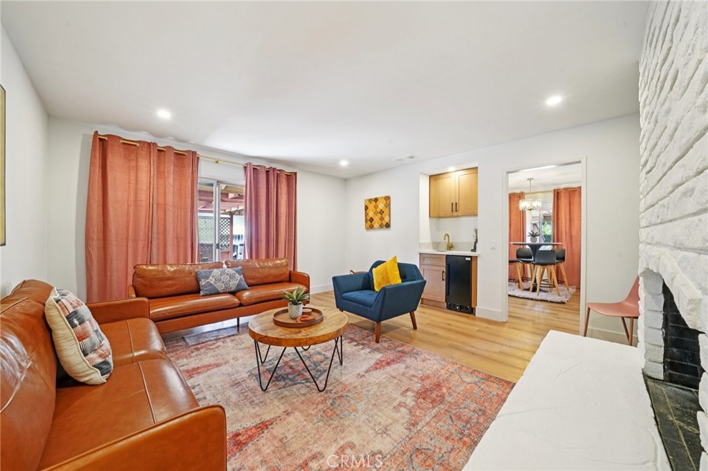 1500 Country Club Drive Riverside, CA 92506 - Photo 9 of 39 a living room with furniture and a wooden floor