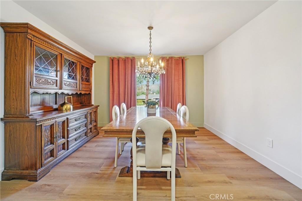 1500 Country Club Drive Riverside, CA 92506 - Photo 10 of 39 a dining room with furniture window and wooden floor