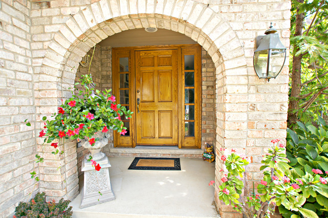 11 Tartan Ridge Road Burr Ridge, IL 60527 - Photo 2 of 25 a vase with flowers sitting on a floor in front of a door