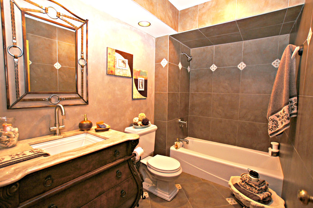 11 Tartan Ridge Road Burr Ridge, IL 60527 - Photo 23 of 25 a bathroom with a sink a toilet and shower