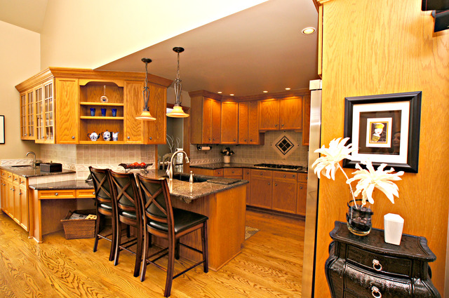 11 Tartan Ridge Road Burr Ridge, IL 60527 - Photo 8 of 25 a kitchen with a sink and chairs