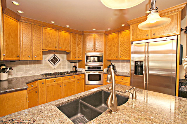 11 Tartan Ridge Road Burr Ridge, IL 60527 - Photo 9 of 25 a kitchen with a sink cabinets and stainless steel appliances