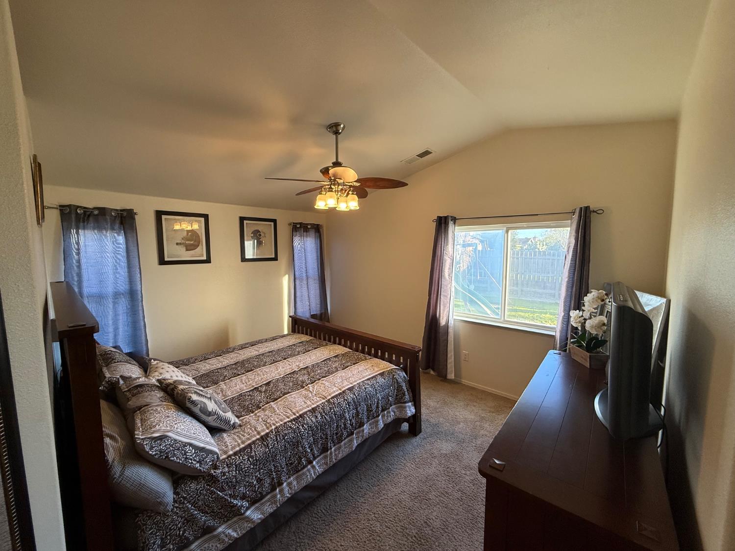 3124 Summer Lane Madera, CA 93637 - Photo 18 of 30 a bedroom with a bed and window