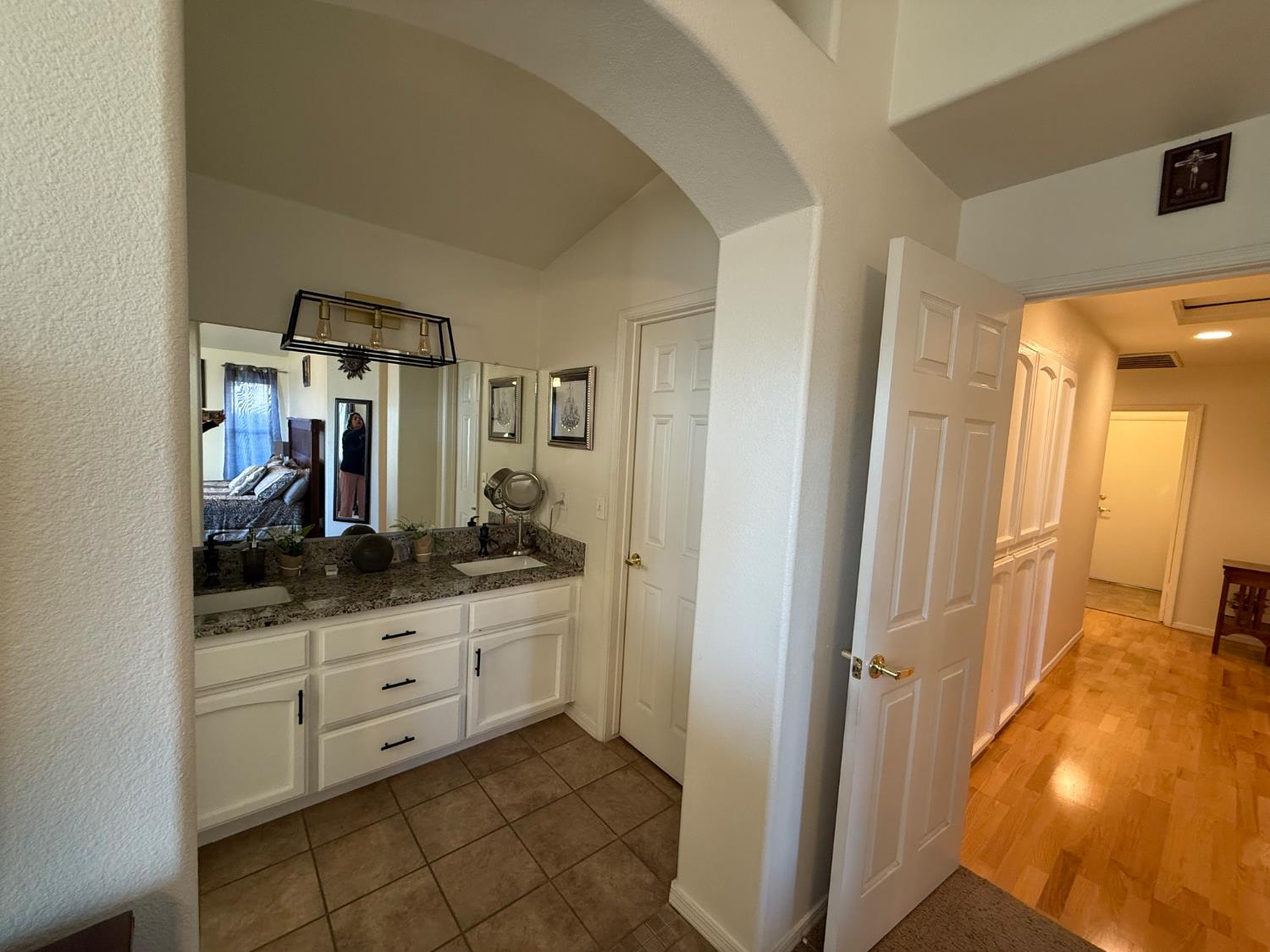 3124 Summer Lane Madera, CA 93637 - Photo 20 of 30 a bathroom with a sink a mirror and a shower