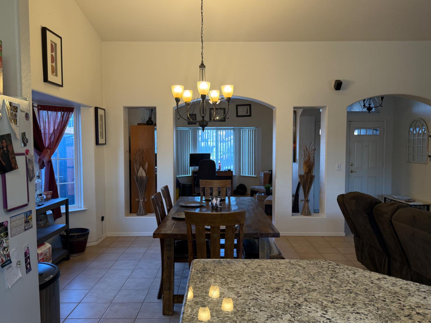 3124 Summer Lane Madera, CA 93637 - Photo 3 of 30 a view of a livingroom with furniture and chandelier
