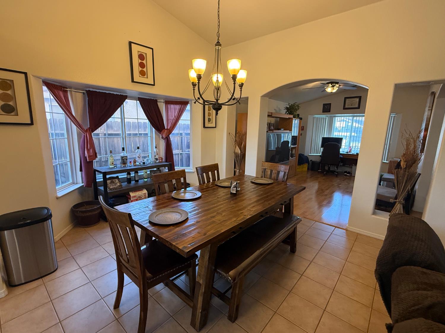 3124 Summer Lane Madera, CA 93637 - Photo 4 of 30 a dining room with furniture and a chandelier