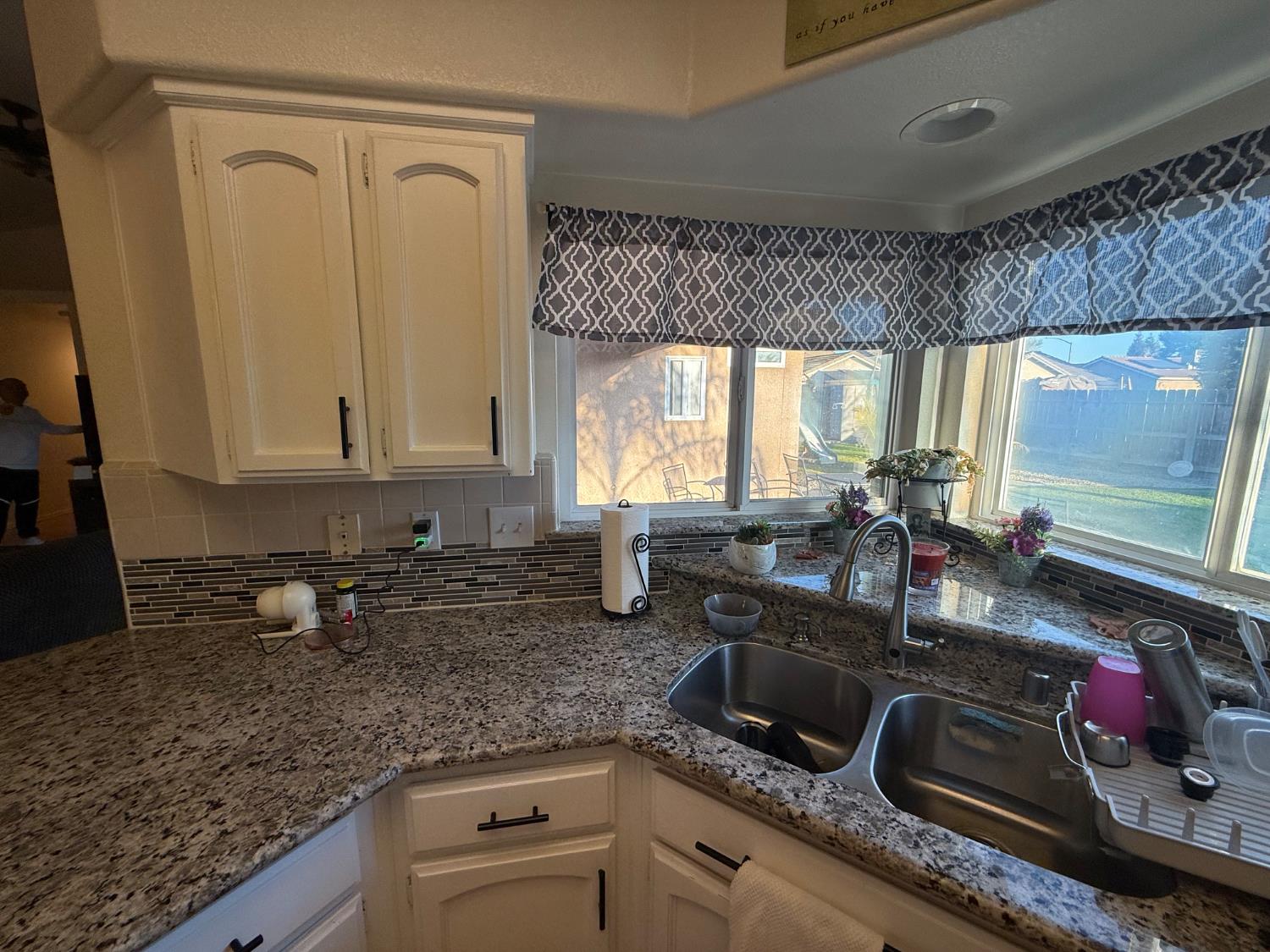 3124 Summer Lane Madera, CA 93637 - Photo 6 of 30 a kitchen with sink a window and cabinets