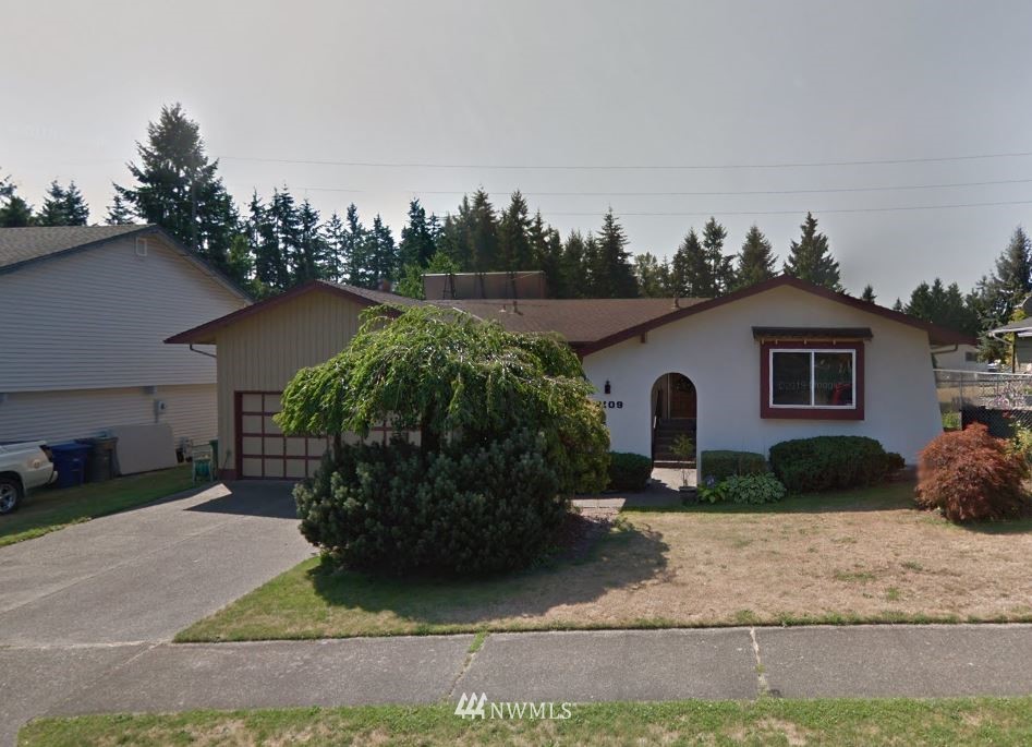 2109 Southeast 22nd Place Renton, WA 98055 - Photo 1 of 1 a view of a house with backyard and garden