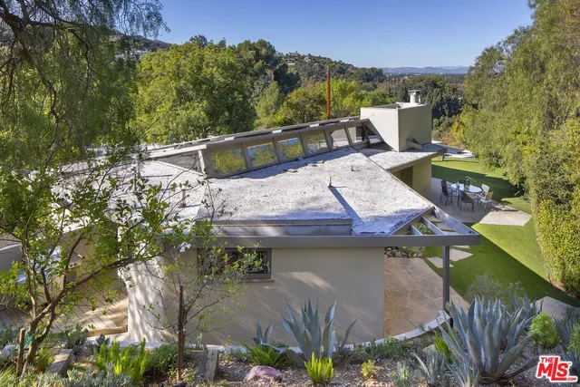 a view of a chairs and table on the terrace