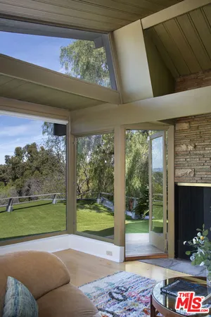 a kitchen with stainless steel appliances granite countertop a refrigerator a stove and a sink