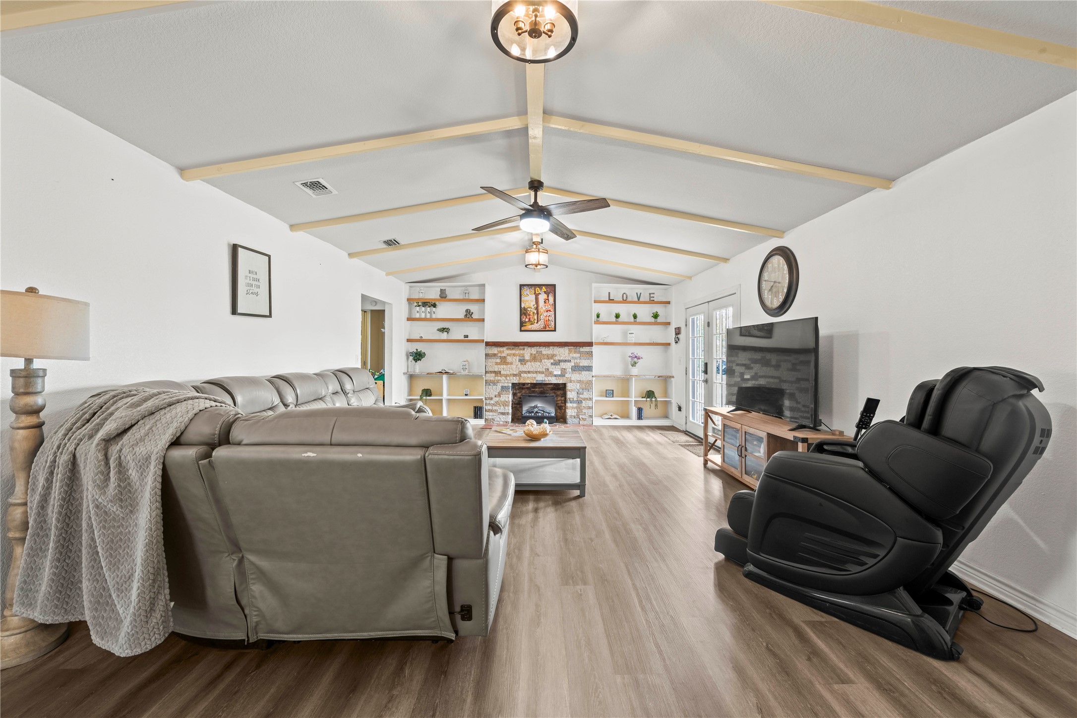 2915 County Road 153 Georgetown, TX 78626 - Photo 3 of 24 a living room with furniture a fireplace and white walls