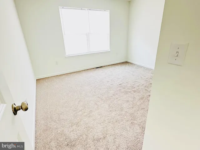 an empty room with a wooden door