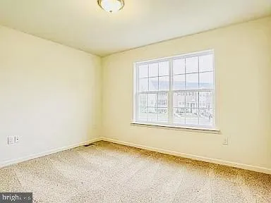 an empty room with a chandeliers